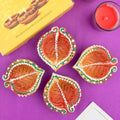 Set of 4 leaf-shaped hand-painted clay diya oil lamps for Diwali