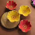 Set of 4 flower-shaped hand-painted terracotta diya oil lamps
