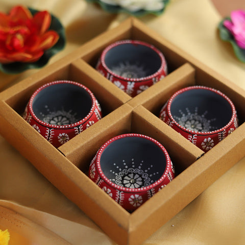 Set of 4 red hand-painted terracotta diya oil lamps in a gift box