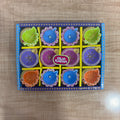 Set of 12 painted terracotta diya oil lamps in leaf and flower designs in a gift box
